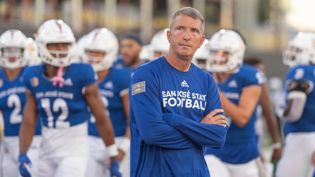 San Jose State Spartans coach Brent Brennan watches warmups before the start of the first quarter against Portland State Vikings at CEFCU Stadium.